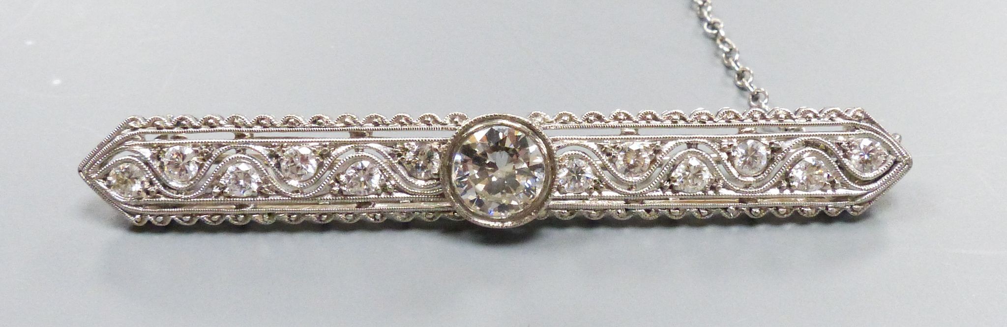 A modern Belle Epoque style pierced 750 white metal and diamond set bar brooch, 58mm, gross weight 7.6 grams